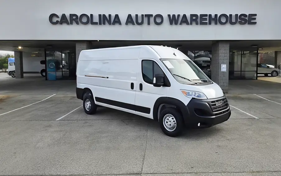 White Work Van in Front of Carolina Auto Warehouse Dealership