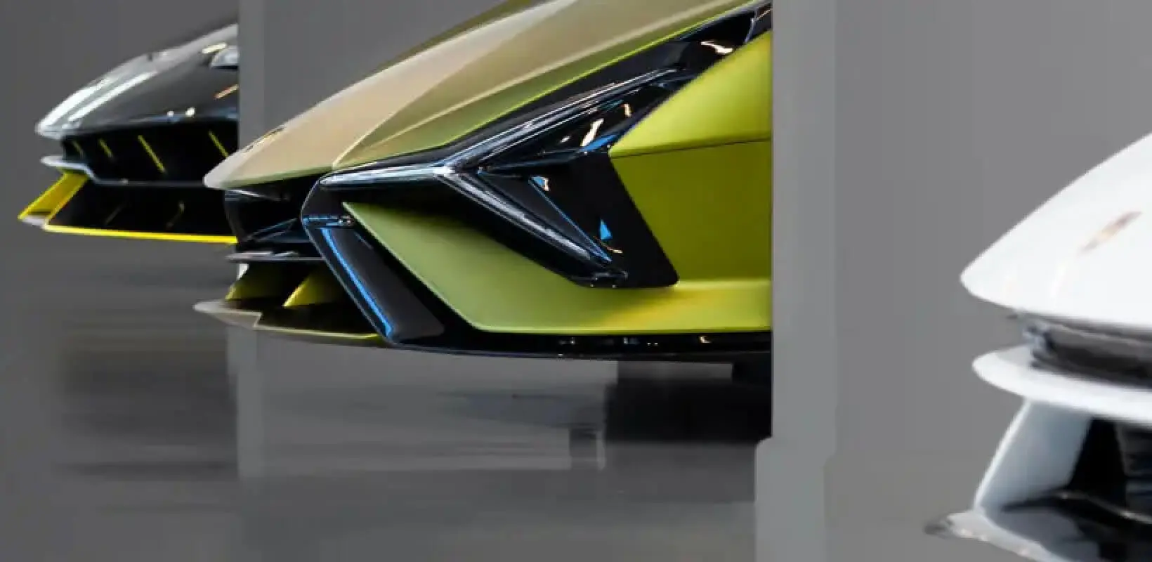 A lineup of luxury car front bumpers.