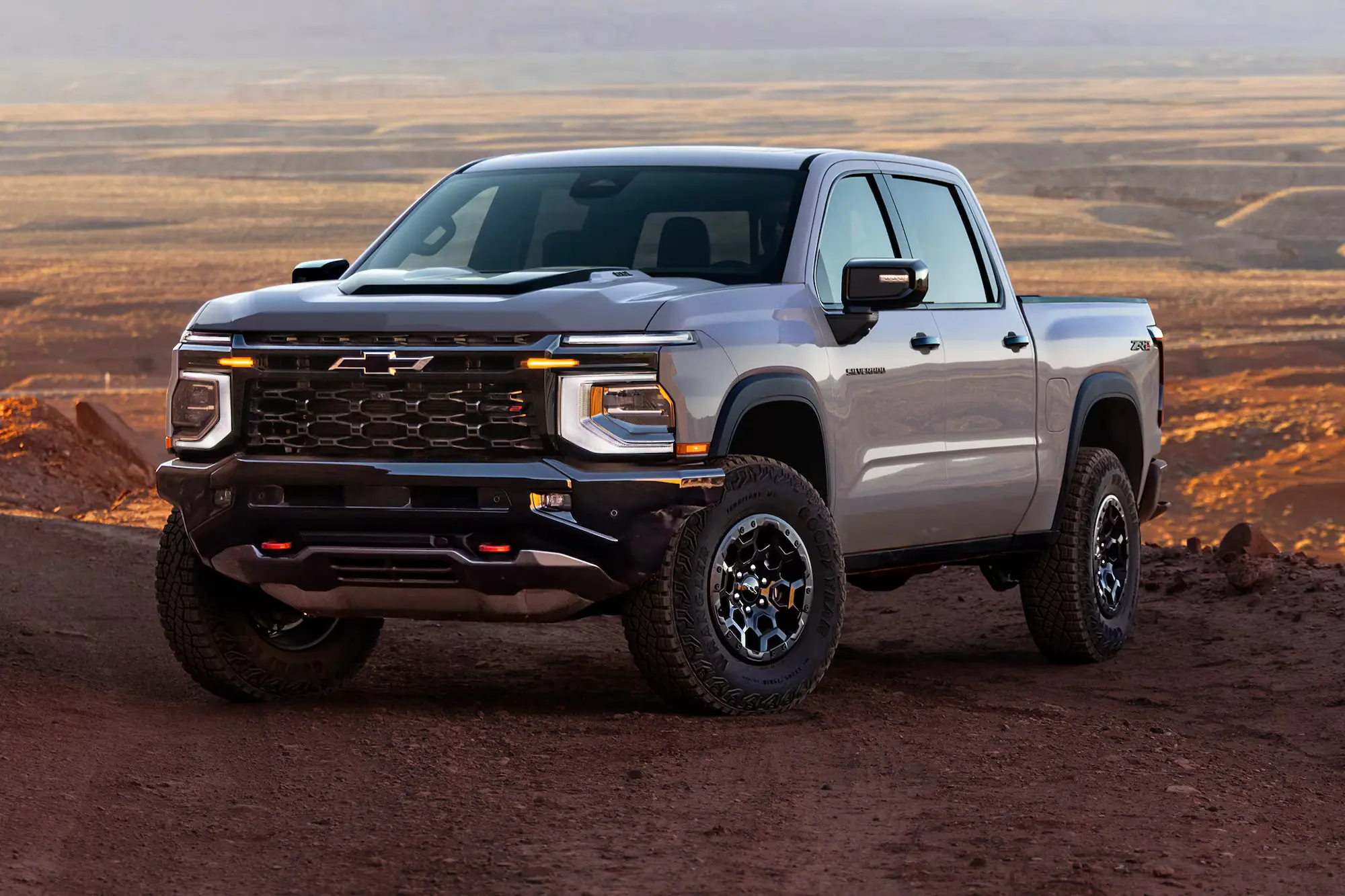 A chevy silverado 1500 sitting parked off-road.