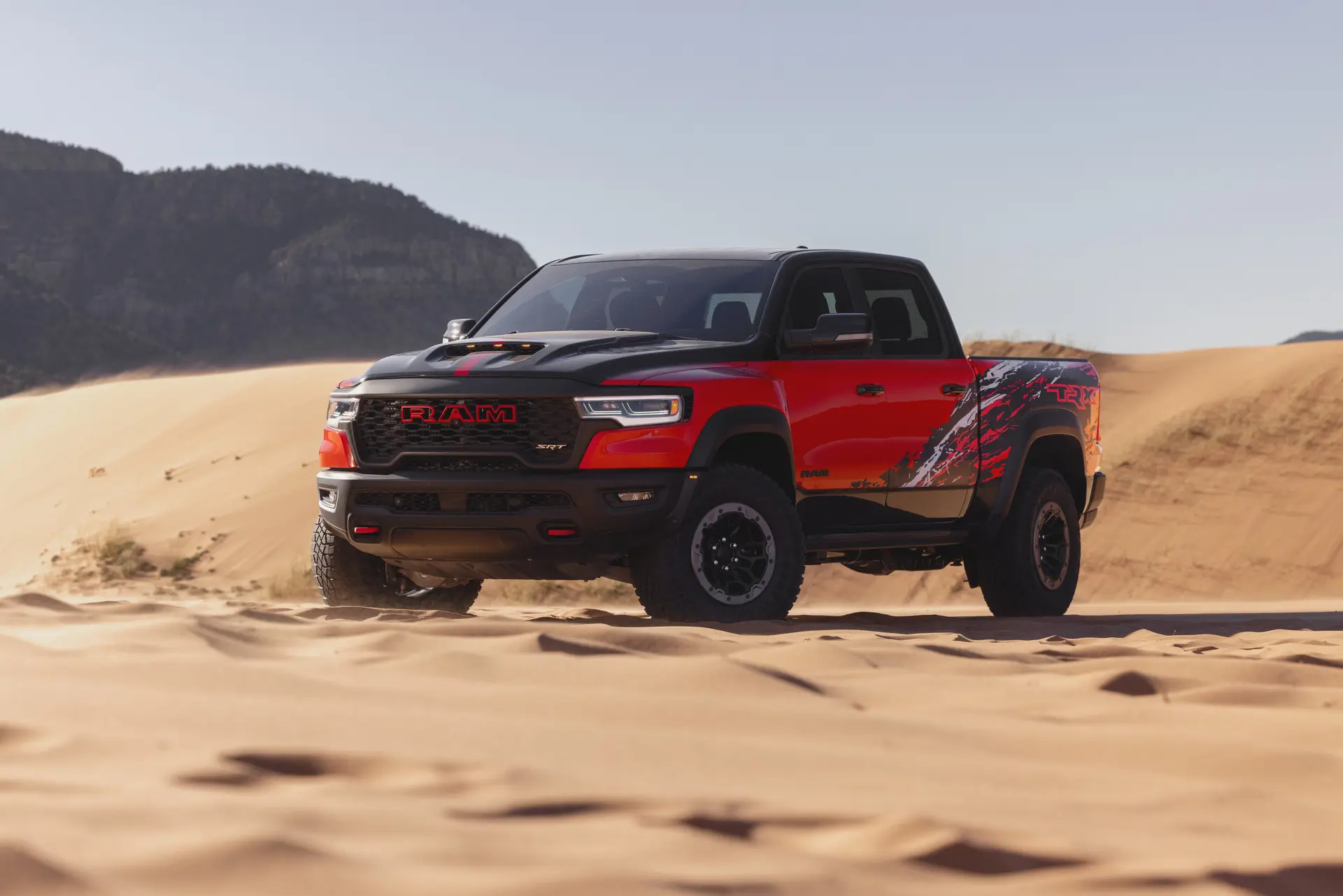 A ram 1500 sitting parked off-road.