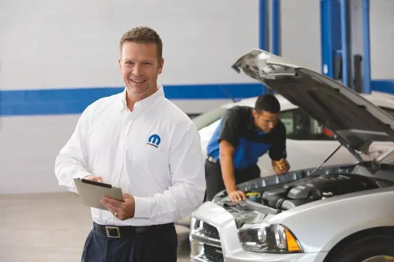 mopar service technician with clipboard