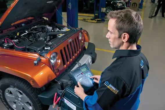 a mopar technician with a clipboard