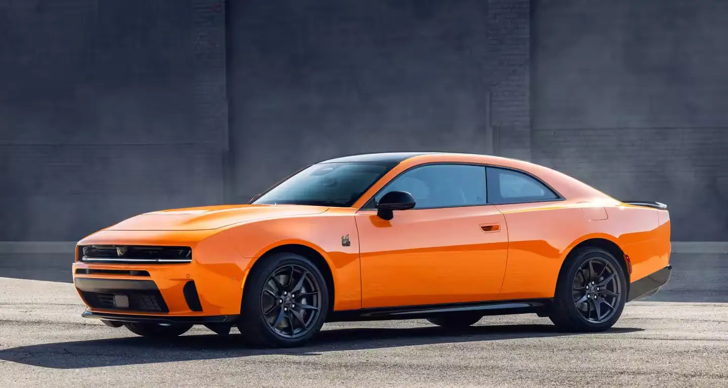 An orange charger sitting parked.