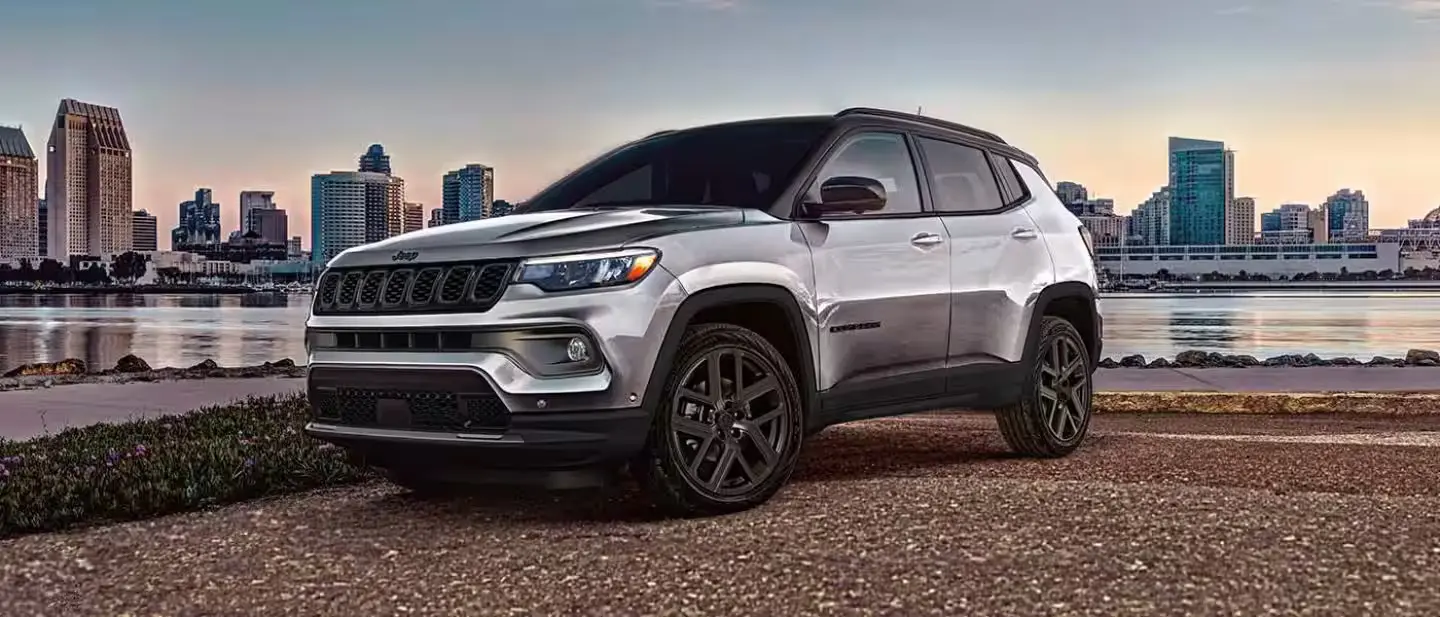 A gray jeep compass sitting parked.