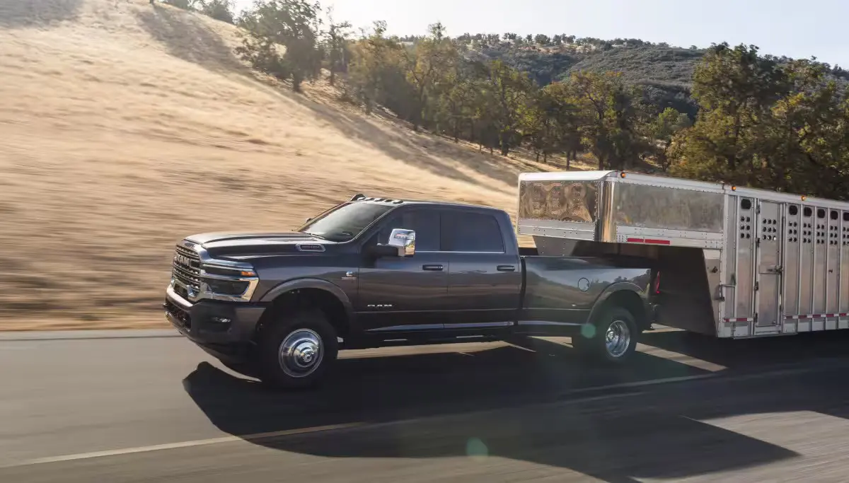 A ram truck pulling a trailer.
