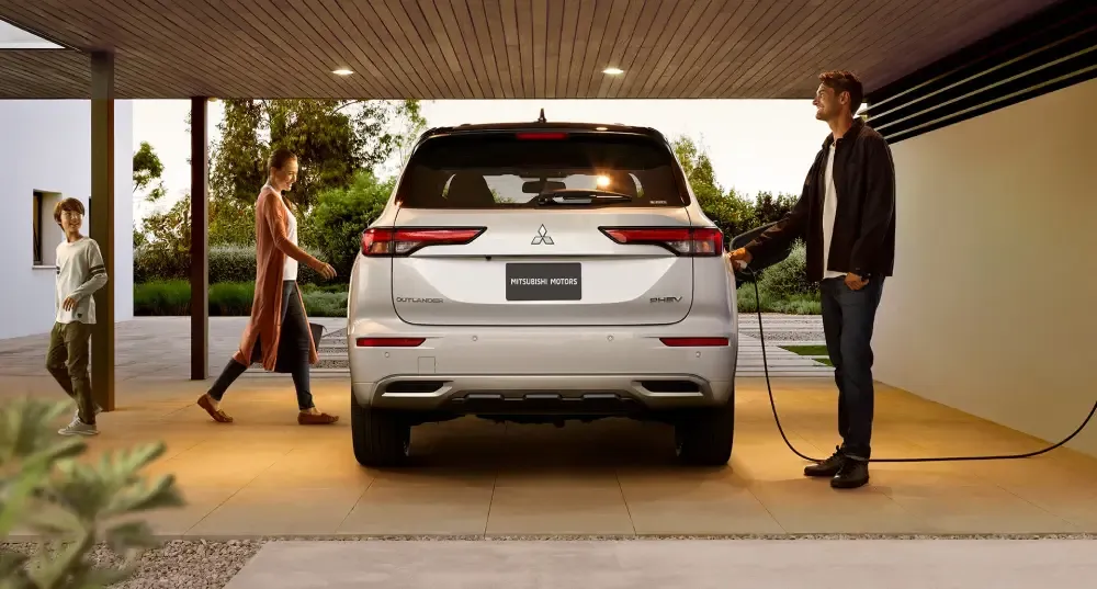 Mitsubishi Outlander PHEV connected to a home charging station