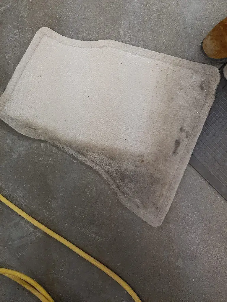 A rug during vehicle detail services.