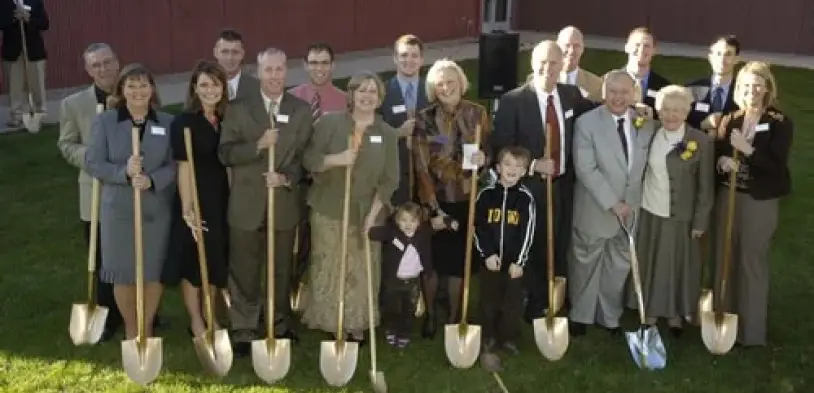 The Howard family and community members at a groundbreaking ceremony, representing the next generation of the Howard legacy