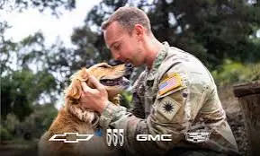 Soldier greeting his dog, with Chevrolet, Buick, GMC and Cadillac logos
