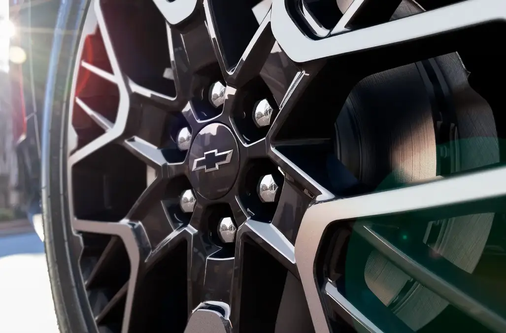 Close-up of a Chevrolet wheel and brake components for collision repair service at Duke Chevrolet GMC