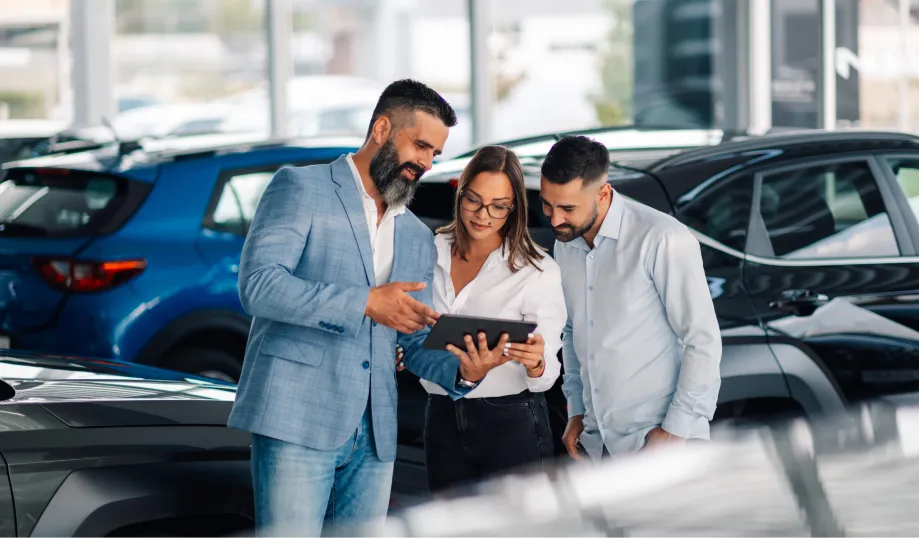 Customers meeting with an Emich Automotive financing professional