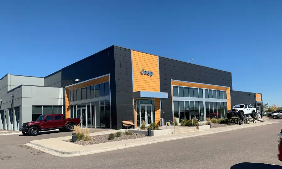Fowler Jeep of Boulder showroom with Rocky Mountain backdrop