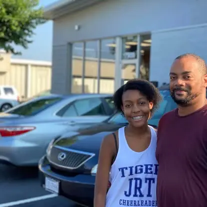 Happy Grace Auto Sales customer picking up a vehicle purchase in Richmond, VA
