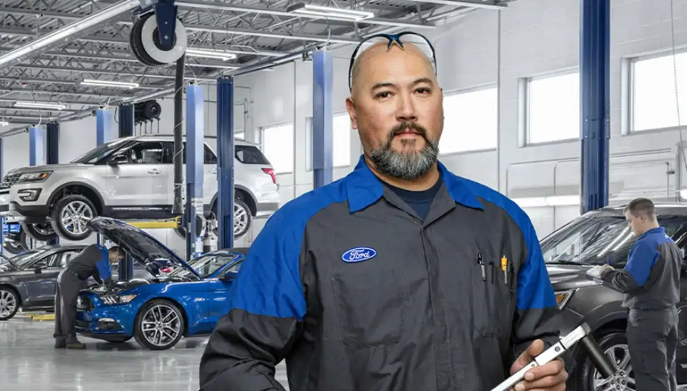 Ford technician in an auto body repair shop