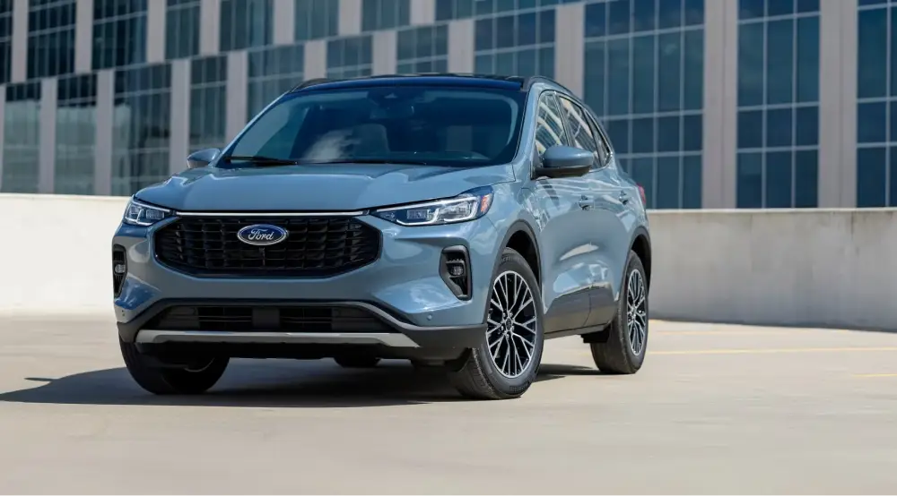 Blue Ford SUV parked on a rooftop level