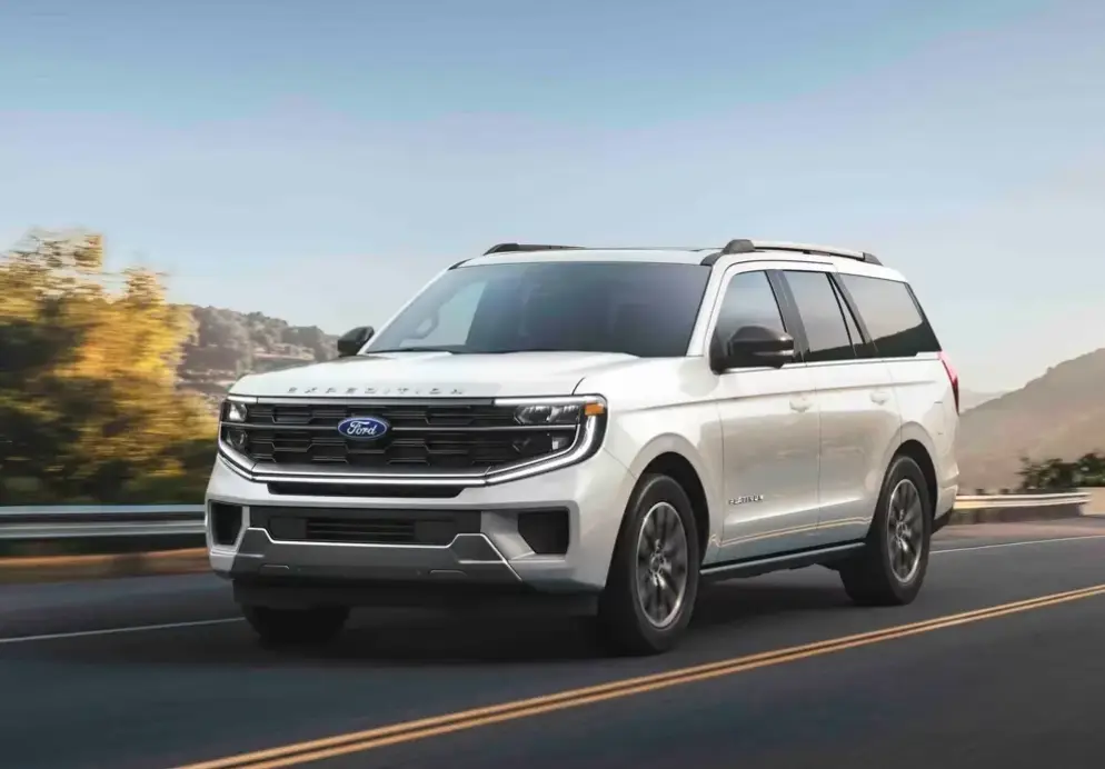 White Ford Expedition driving on the highway