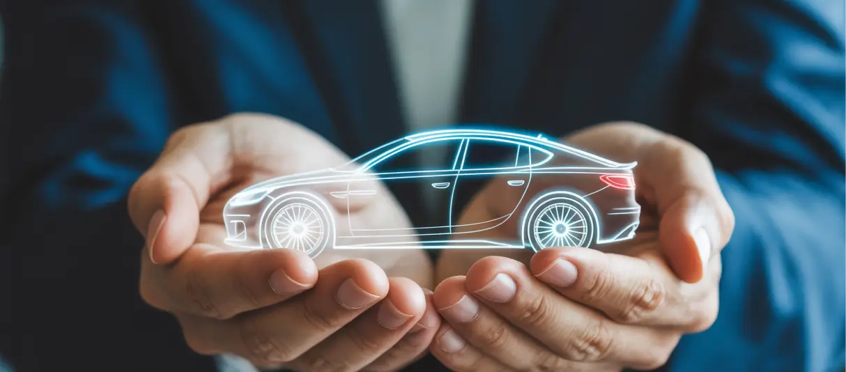Hands holding a glowing digital outline of a car, representing vehicle support.