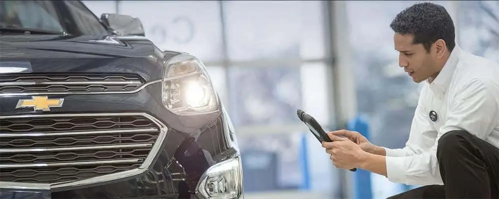 Chevrolet Tech Looking At Car