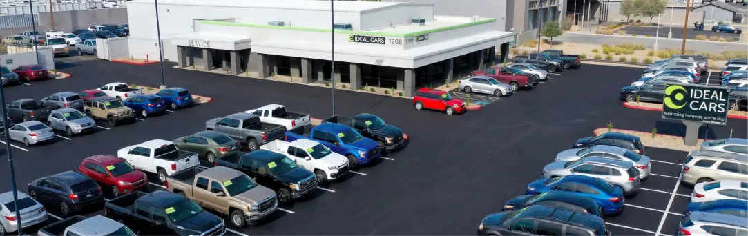 Used car dealership exterior storefront Ideal Cars Broadway