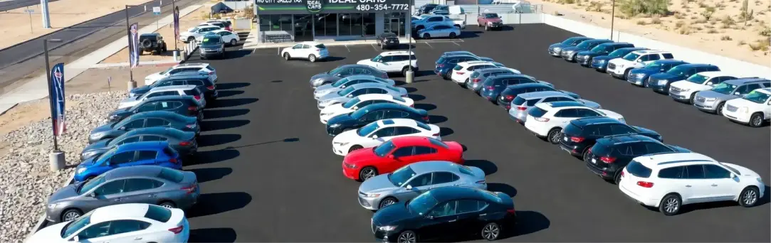 Used car dealership exterior storefront Ideal Cars East Main - Atlas