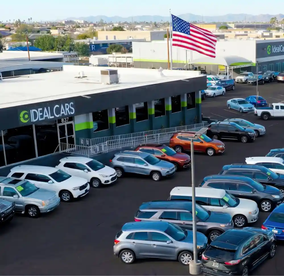 Used car dealership exterior storefront Ideal Cars Main.