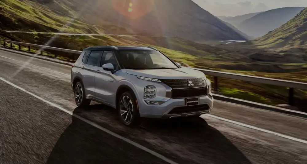 Mitsubishi Outlander PHEV driving on a mountain road