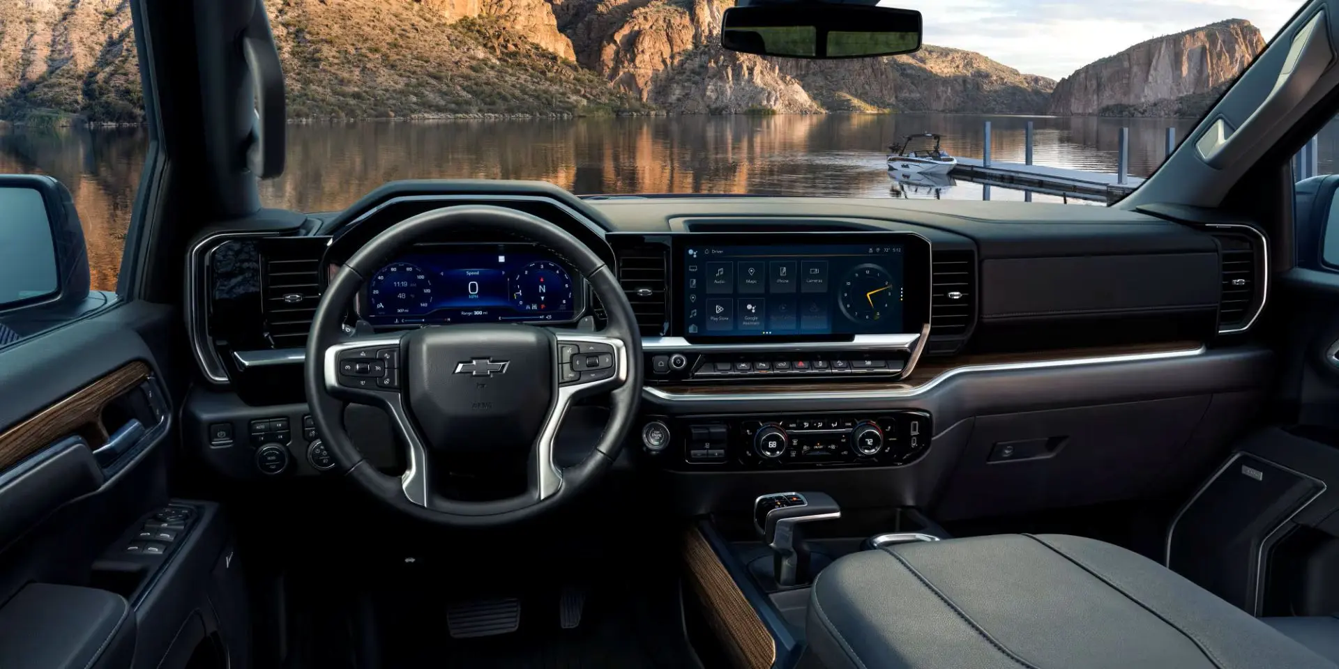 2025 silverado 1500 interior view of driver's view with a lake in front