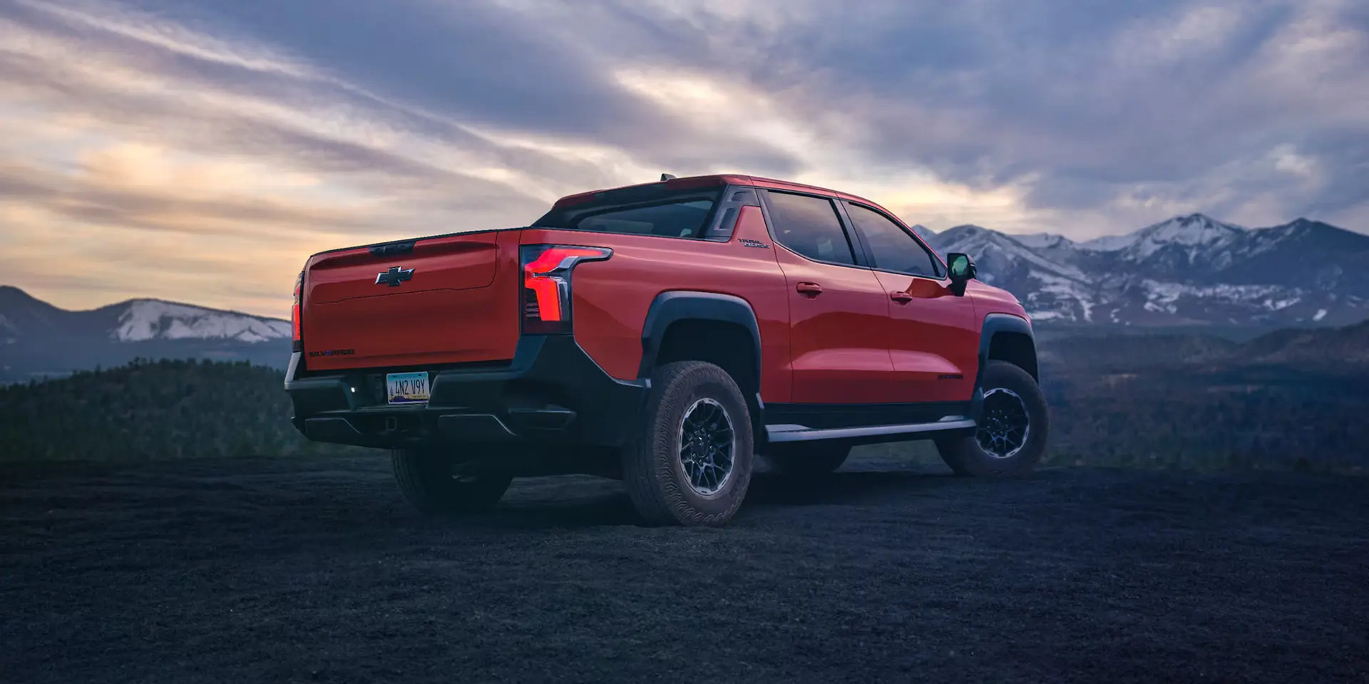 A red truck sitting parked.