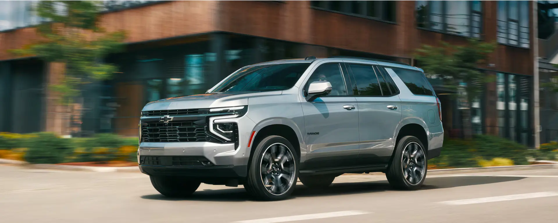 A green suv sitting parked in a field.