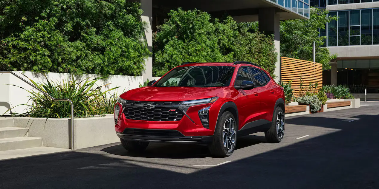 A red chevy trax sitting parked.