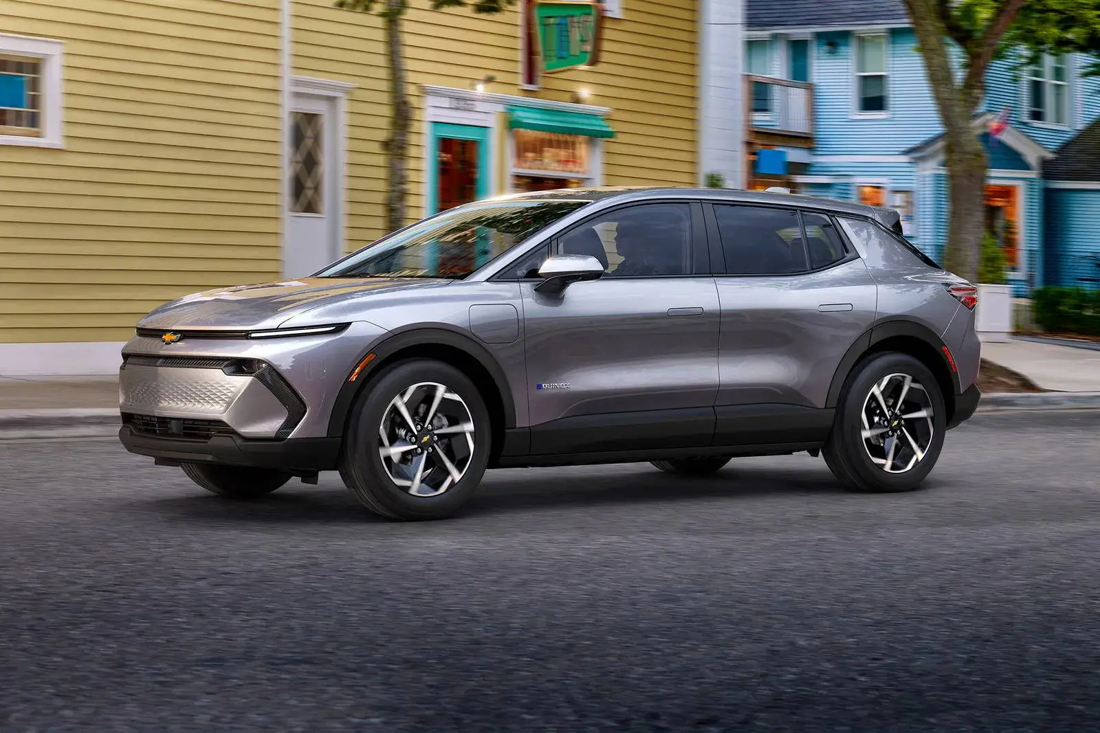A gray equinox lt driving on the road.