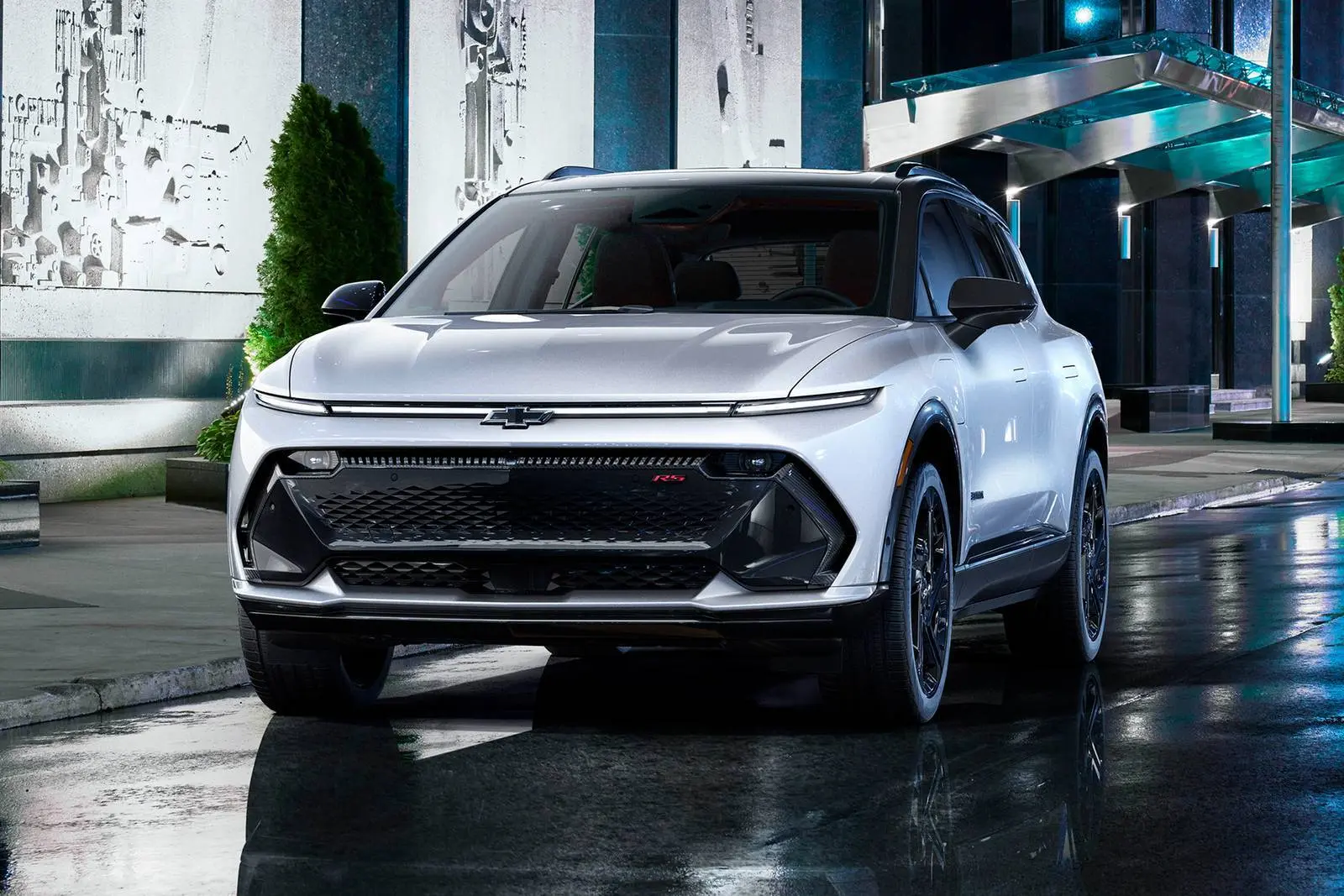 A white suv sitting parked.