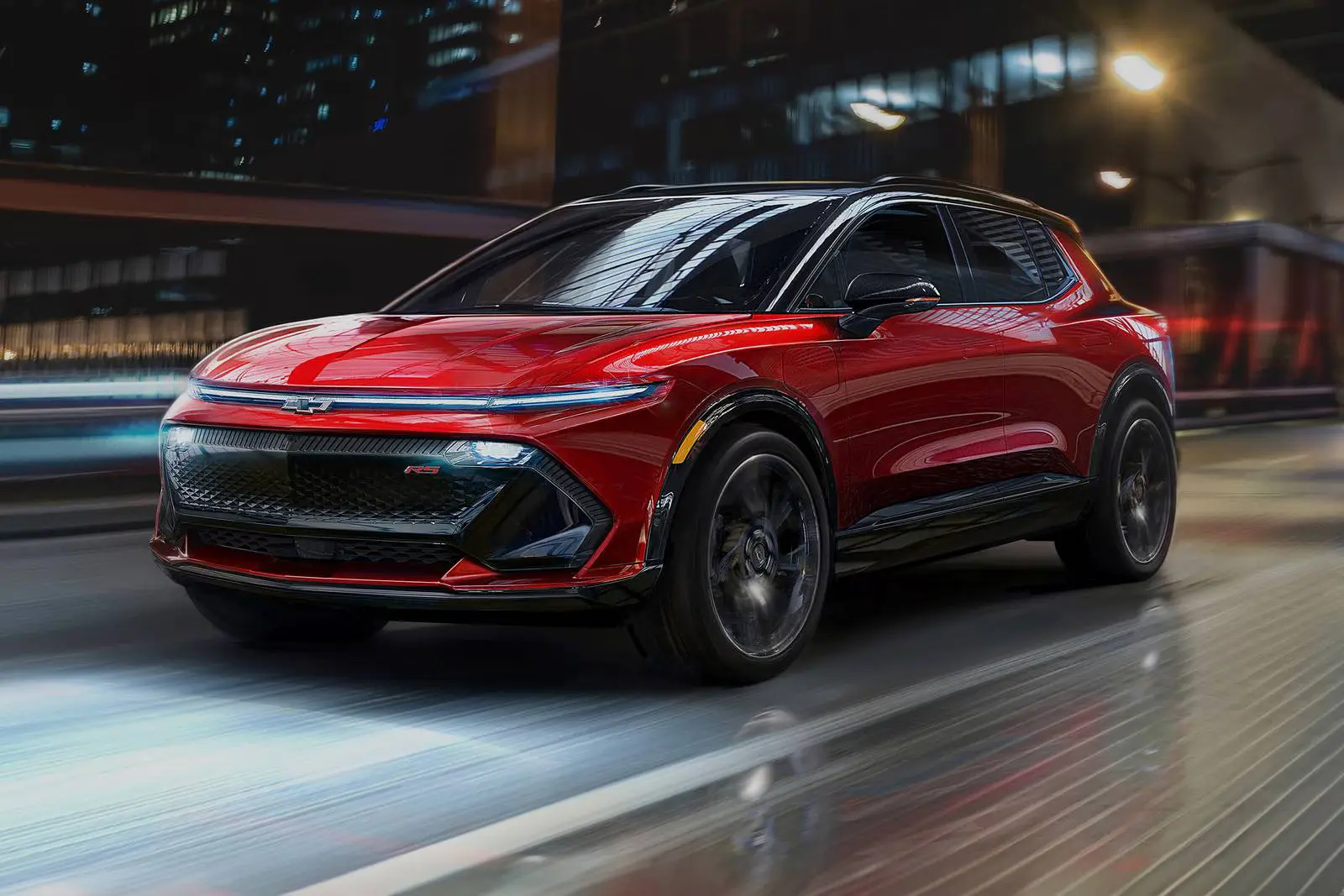 A red equinox ev rs driving on the road.