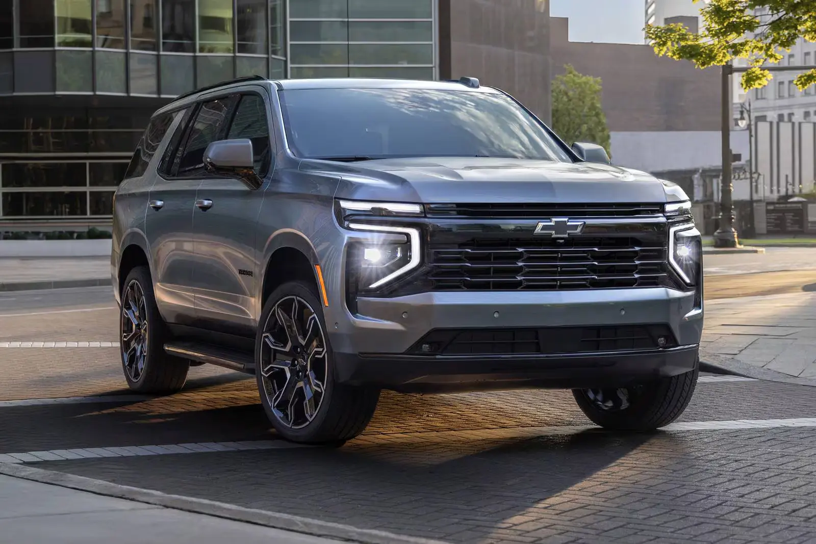 A silver suv sitting parked.