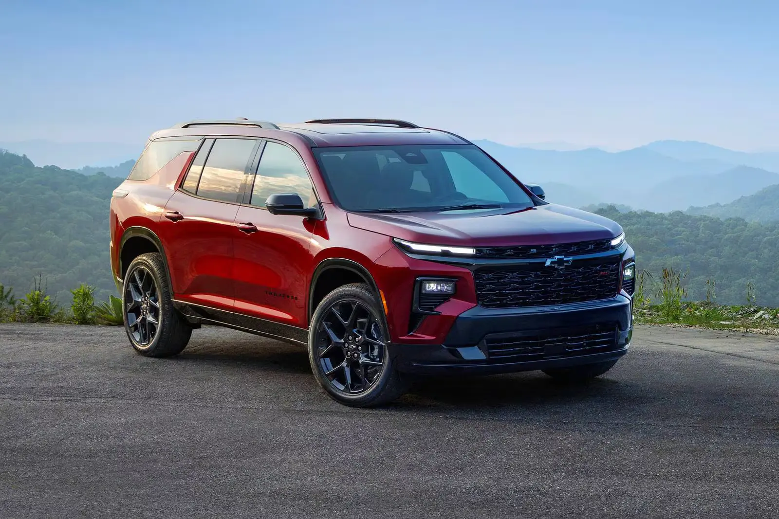 A red traverse sitting parked.