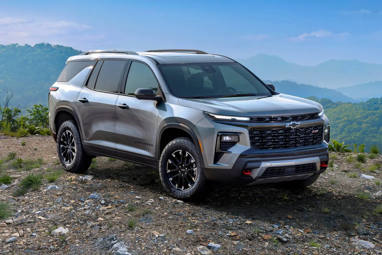 A gray suv sitting parked.