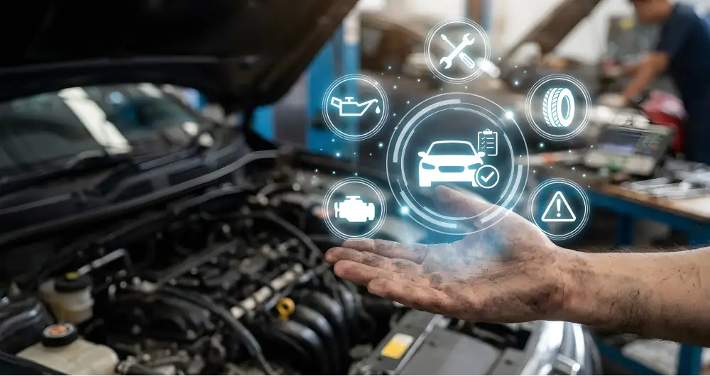 Vehicle diagnostic icons displayed above an open engine bay
