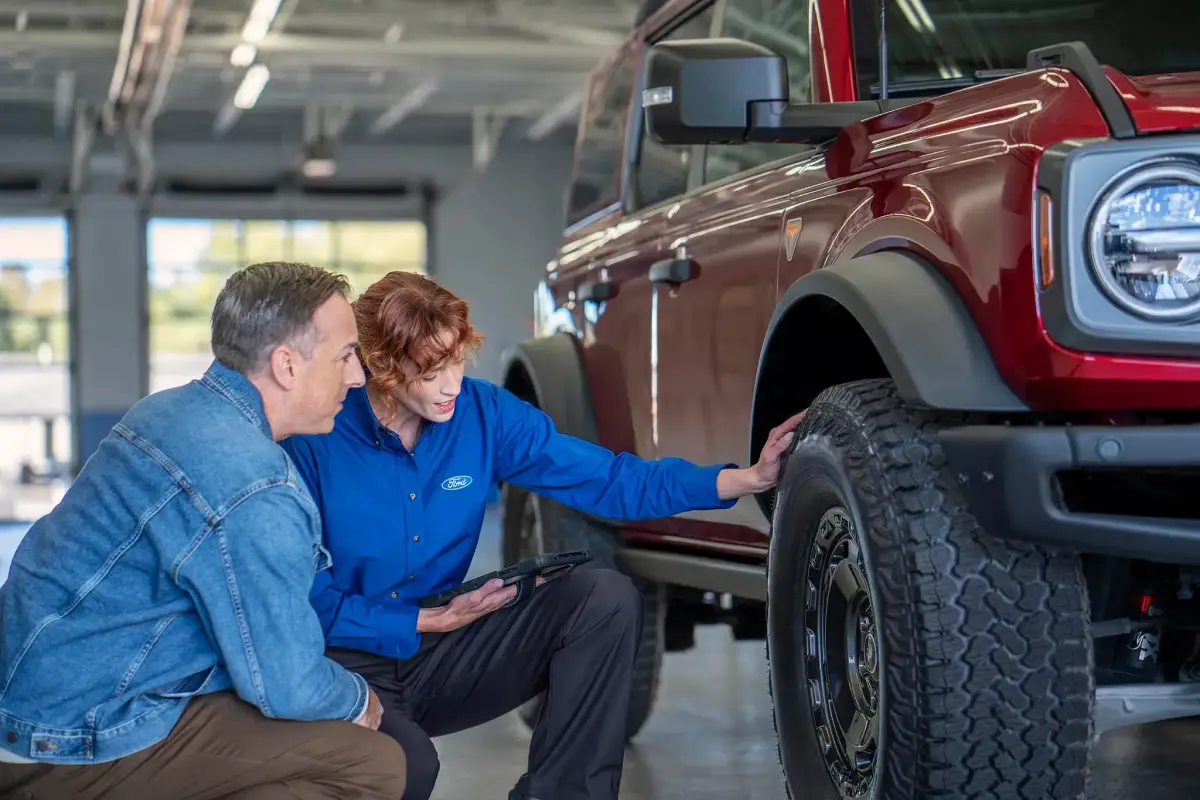 Ford service technician working on a vehicle