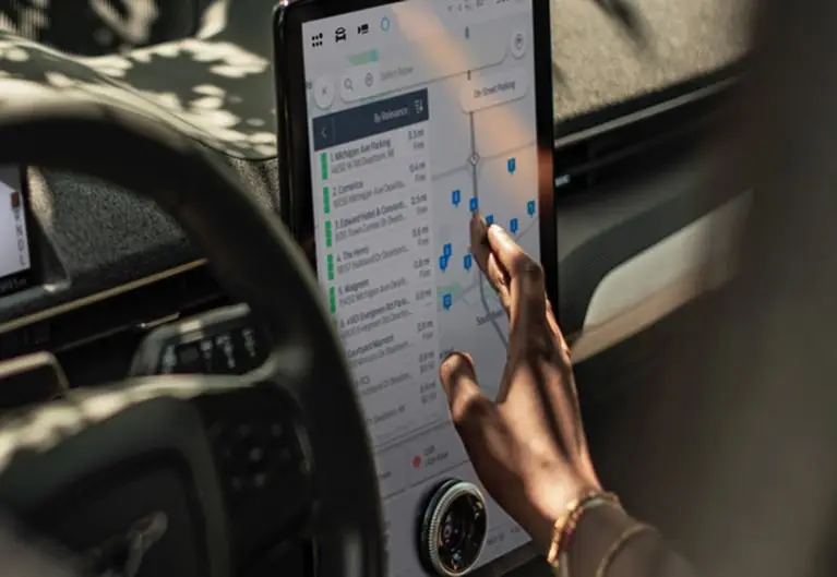 Ford center touchscreen showing Google Maps with several saved destinations