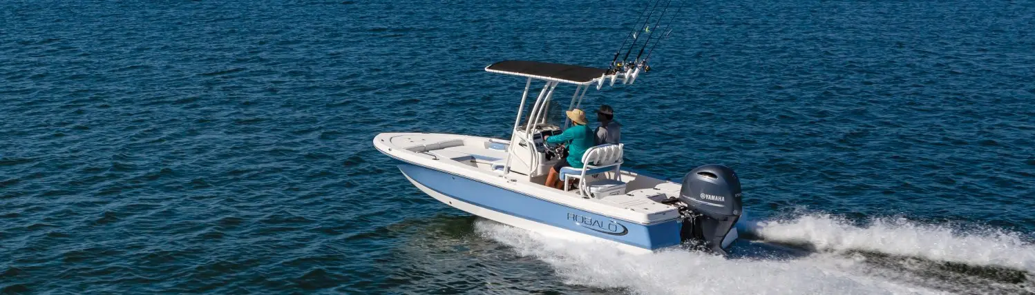 two people riding a robalo cayman 206