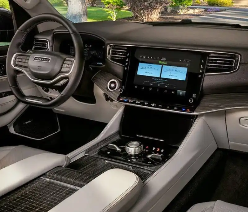 Wagoneer dashboard with steering wheel, center touchscreen, and center console
