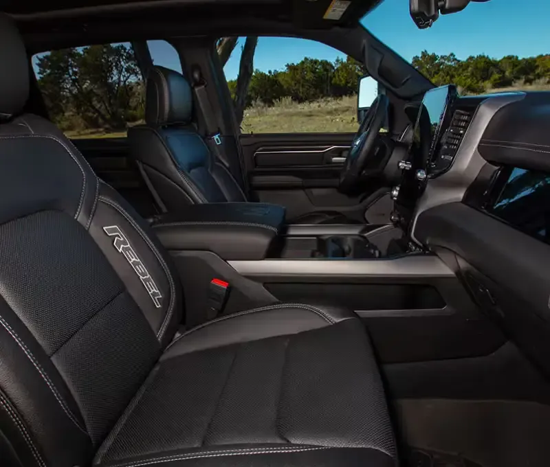 Ram 1500 interior with black seating, center console, and large touchscreen display