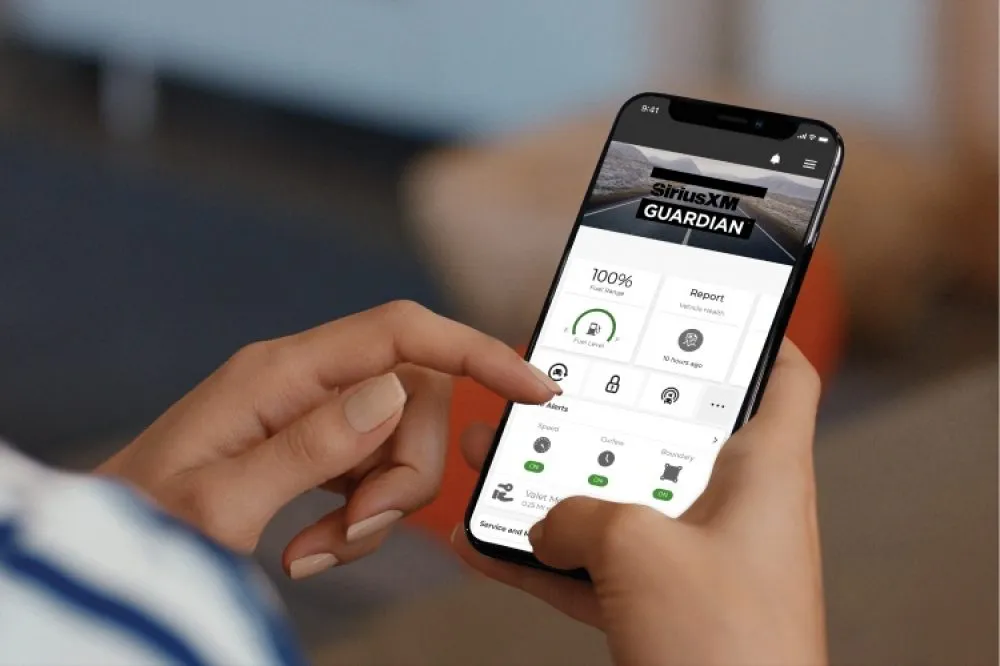 Passenger using Uconnect Access features inside a connected vehicle at Marina Chrysler Dodge Jeep Ram