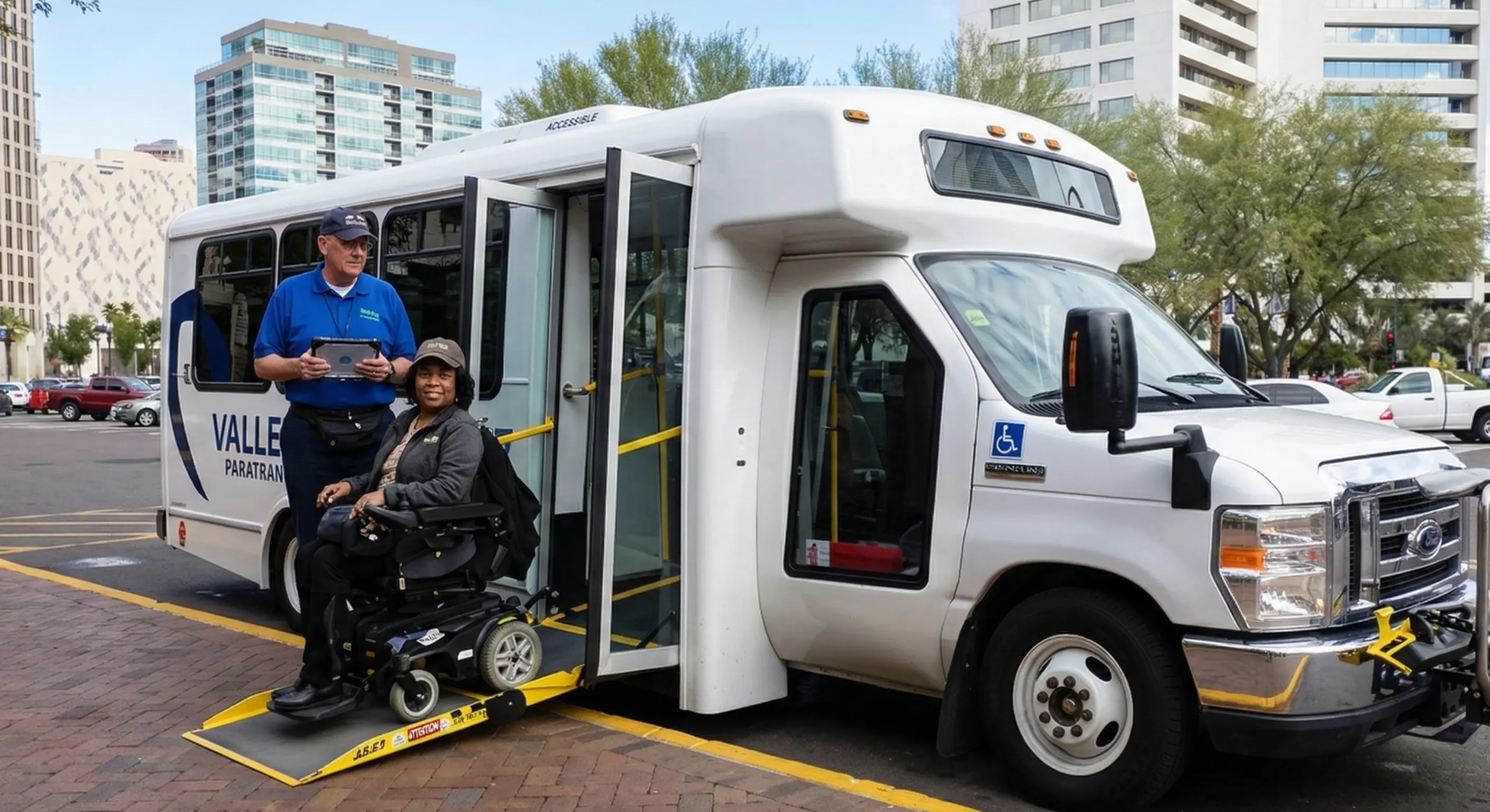 Driver assisting a passenger using an ADA-compliant wheelchair lift in Denver