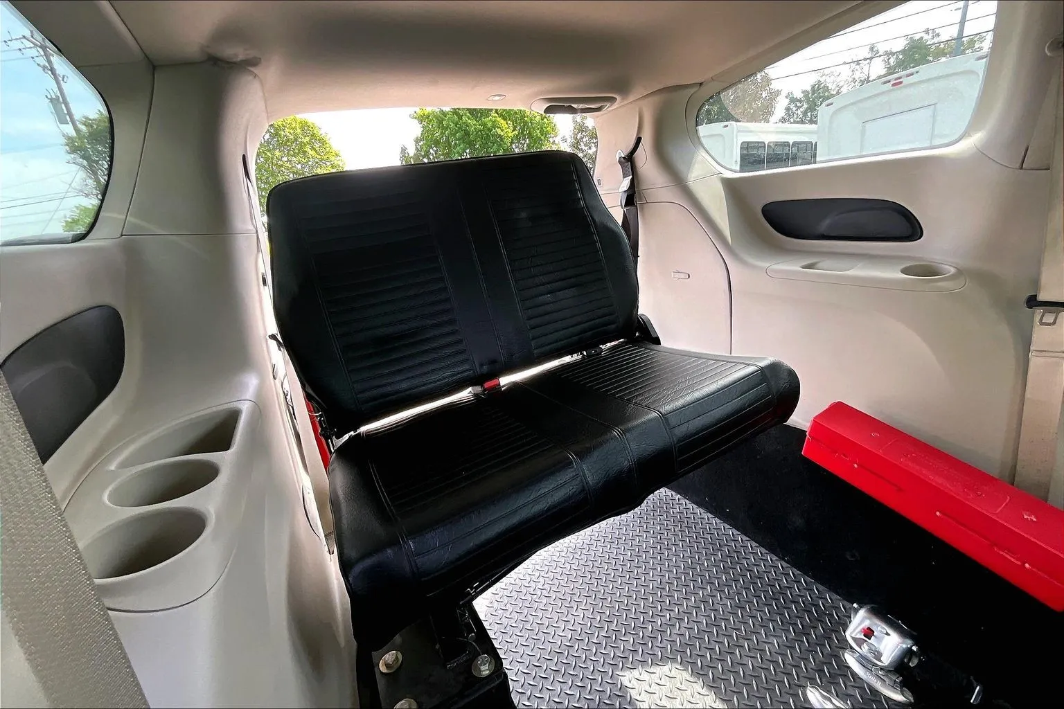 Interior of a Chrysler wheelchair van showing the lowered floor and rear bench seat