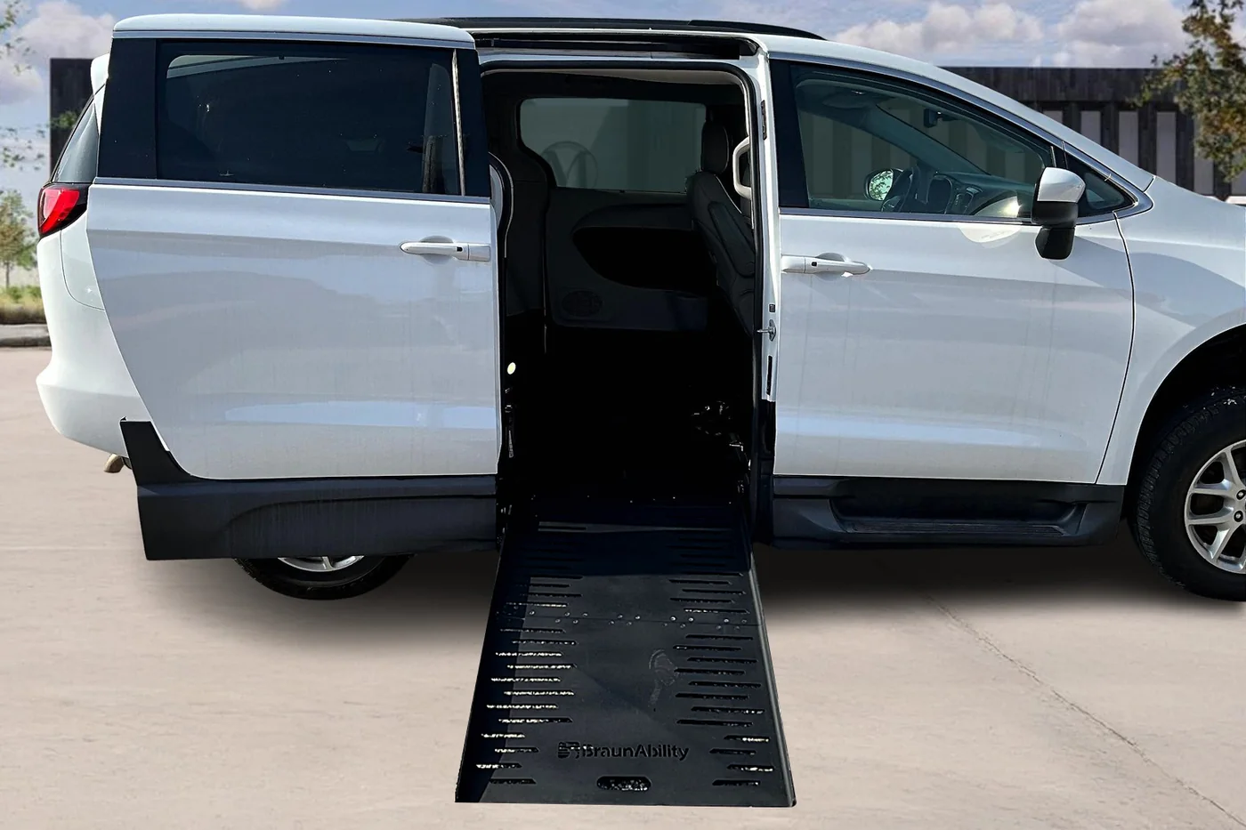 Chrysler Pacifica wheelchair van with its side-entry ramp deployed at Master's Transportation