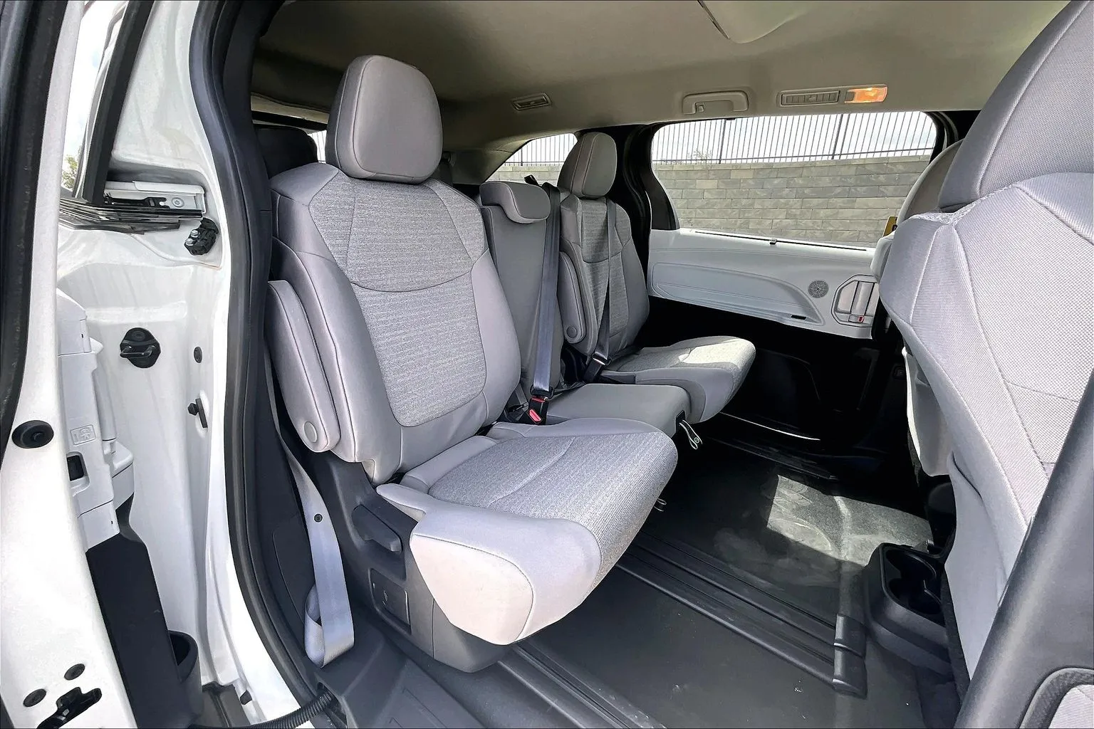 Interior of a Toyota Sienna wheelchair van showing second-row seating and the lowered floor