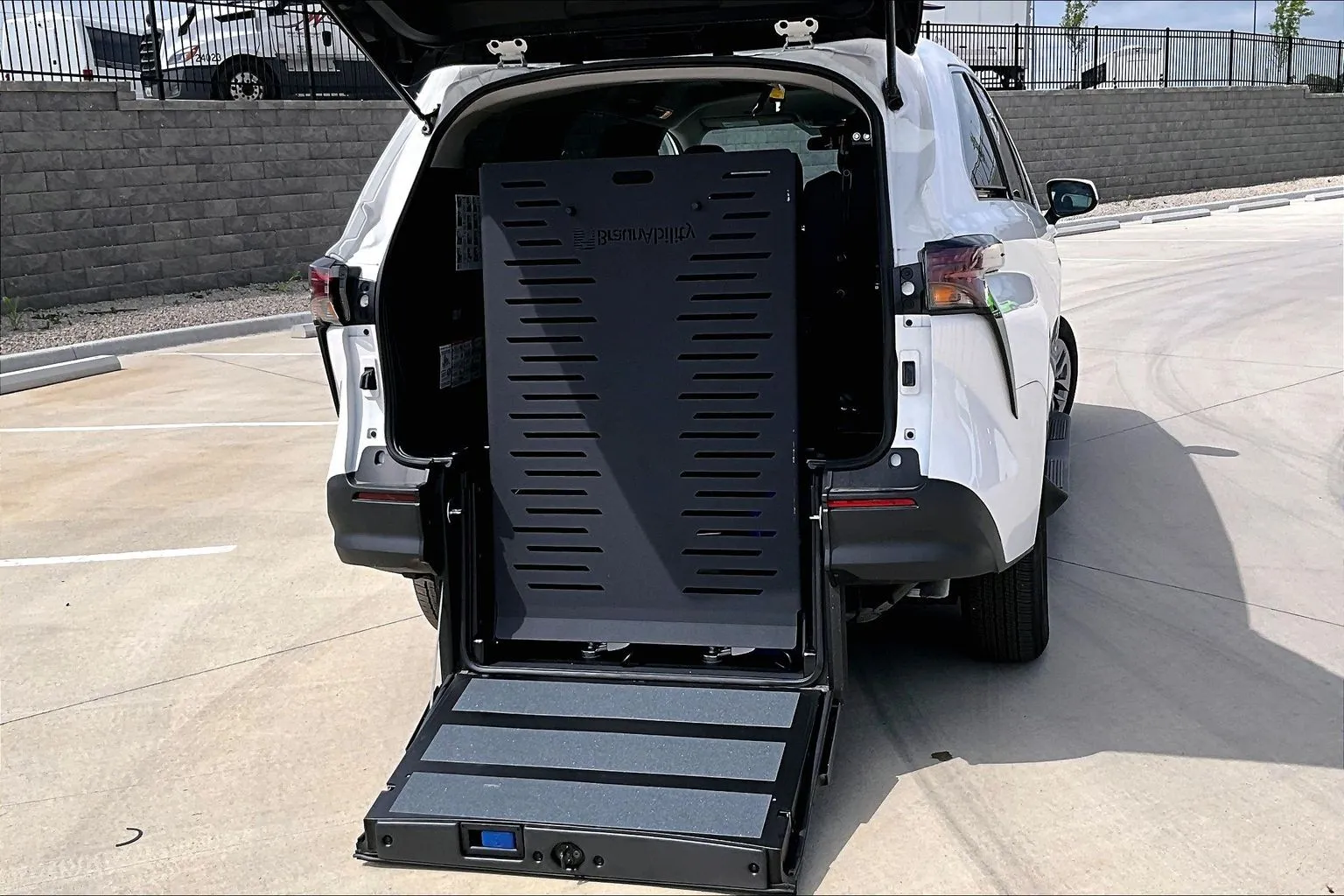 Toyota Sienna wheelchair van with its rear-entry ramp deployed