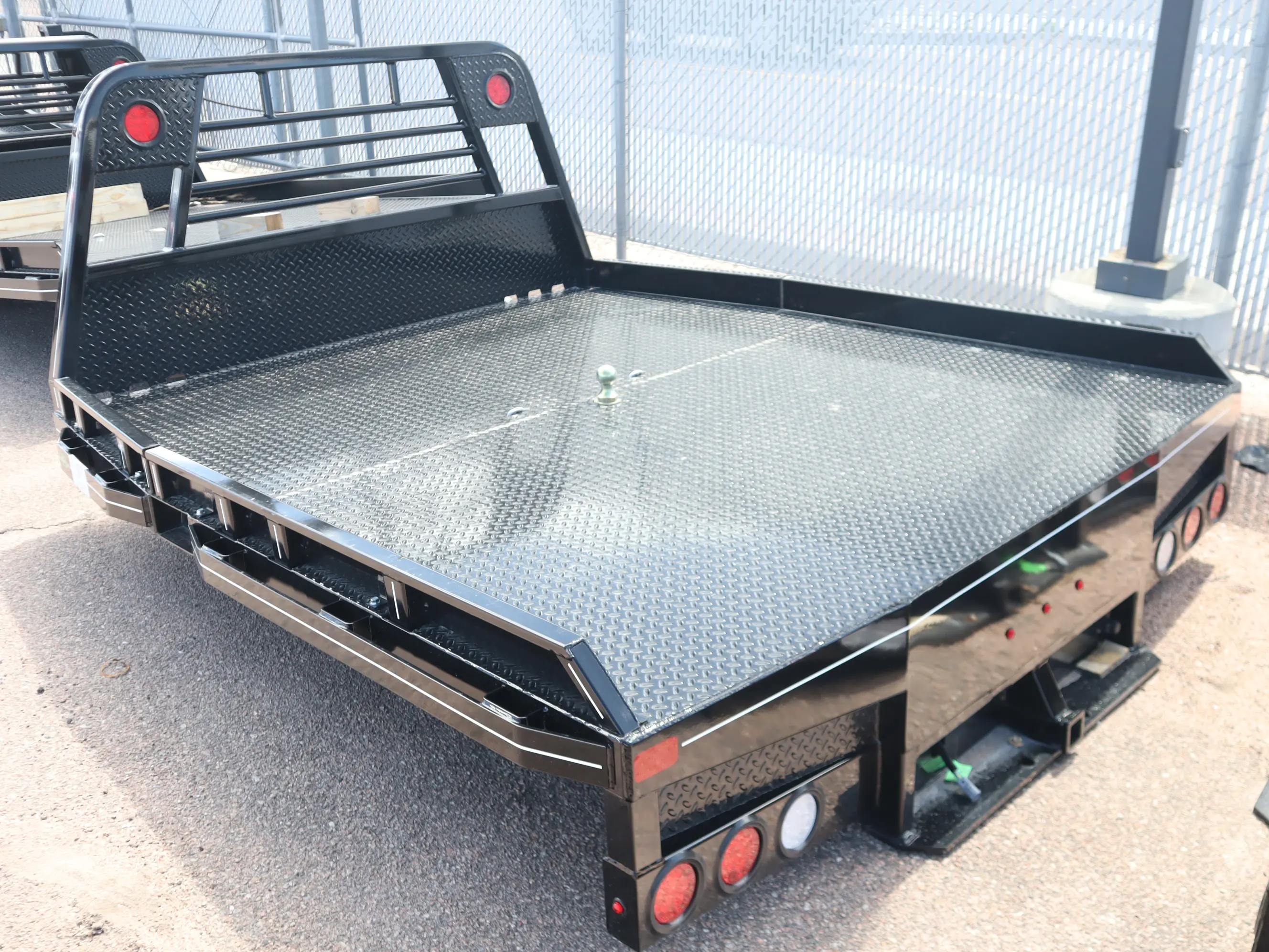 94 x 102 non-skirted Butler flat bed, deck and headache rack detail