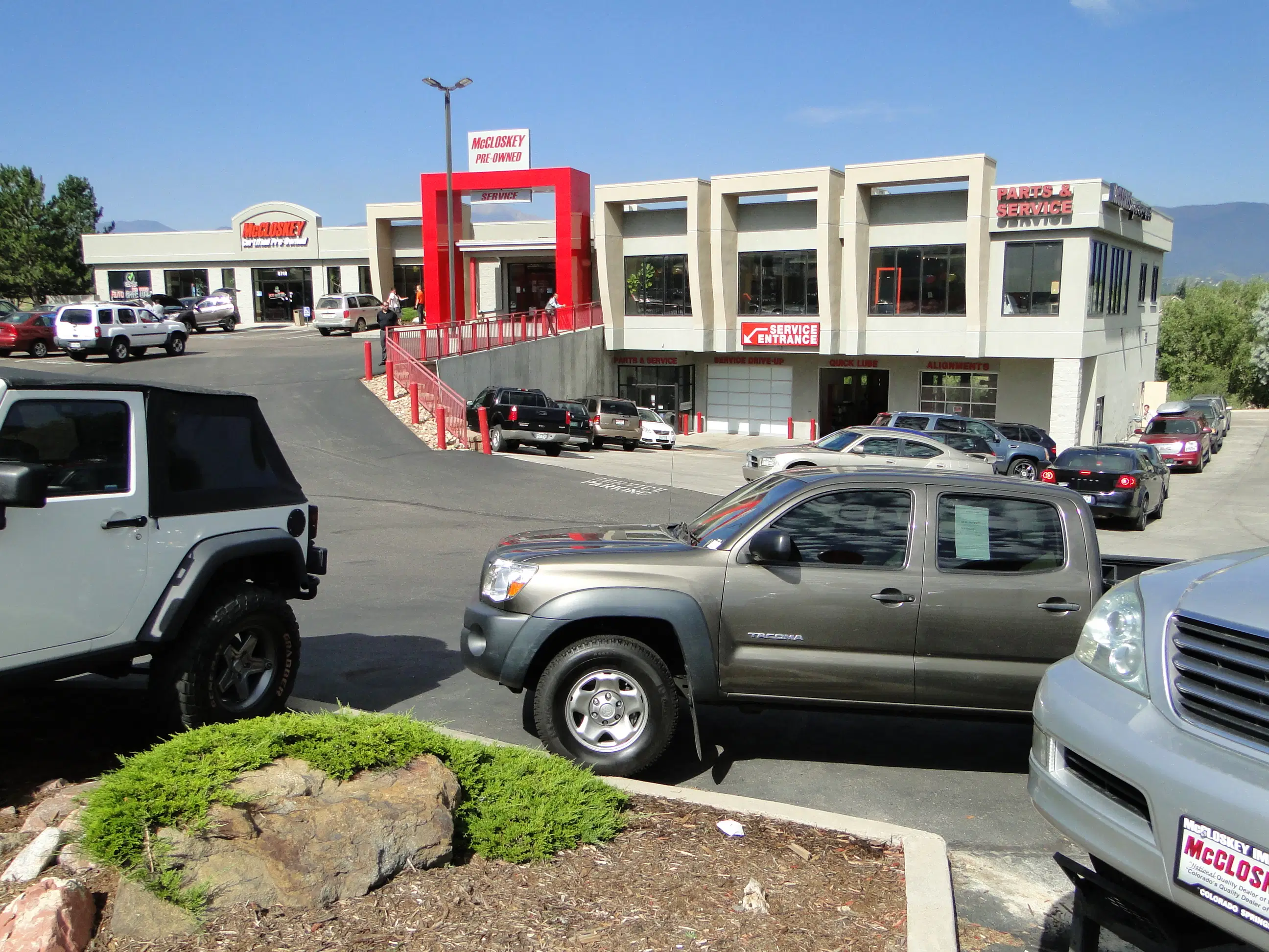 Diverse lineup of pre-owned trucks and SUVs at McCloskey Motors dealership lot